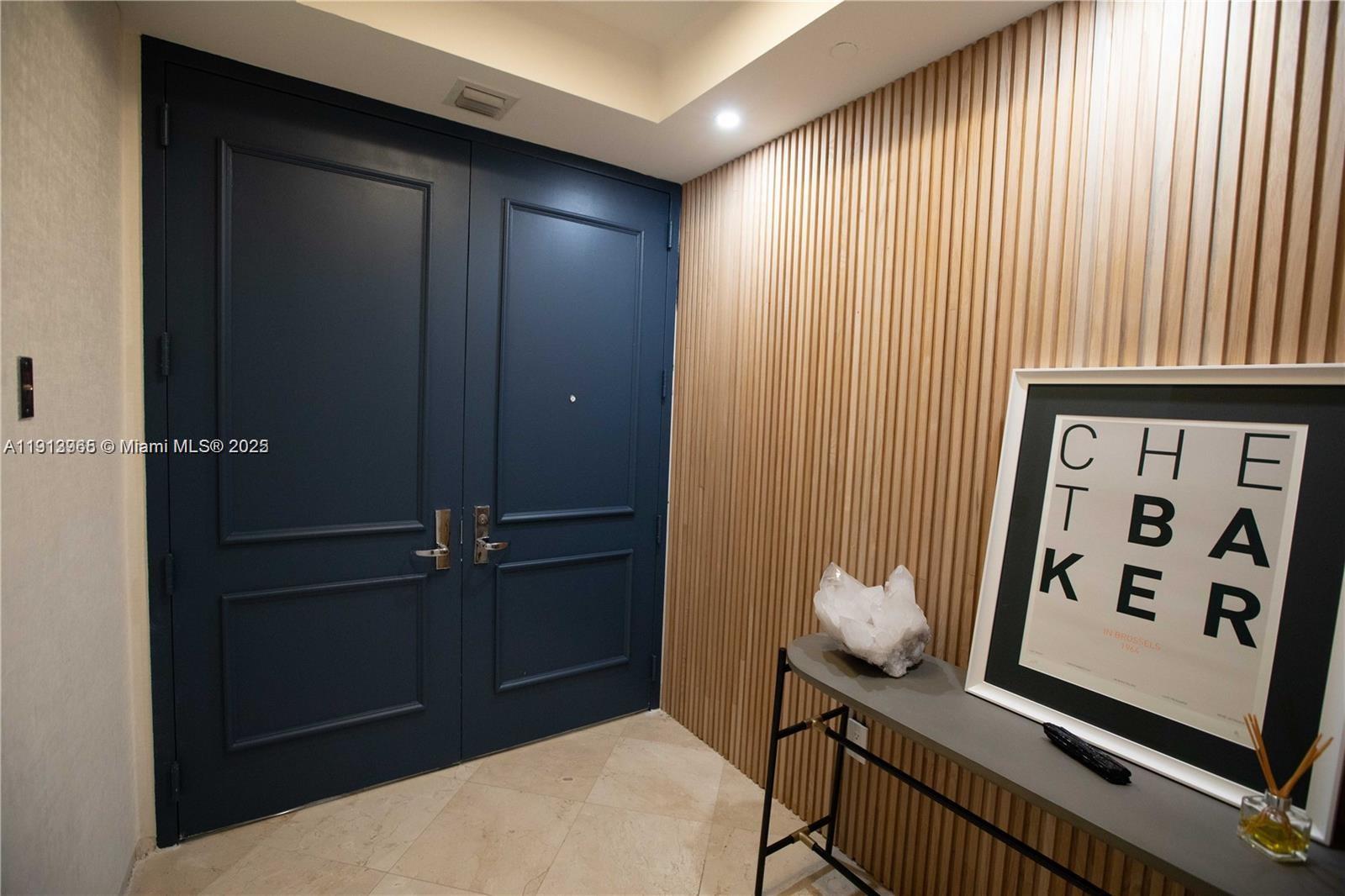 721 Crandon Boulevard, Unit 207 Key Biscayne, FL 33149 - Photo 4 of 8 a view of a hallway with elevator