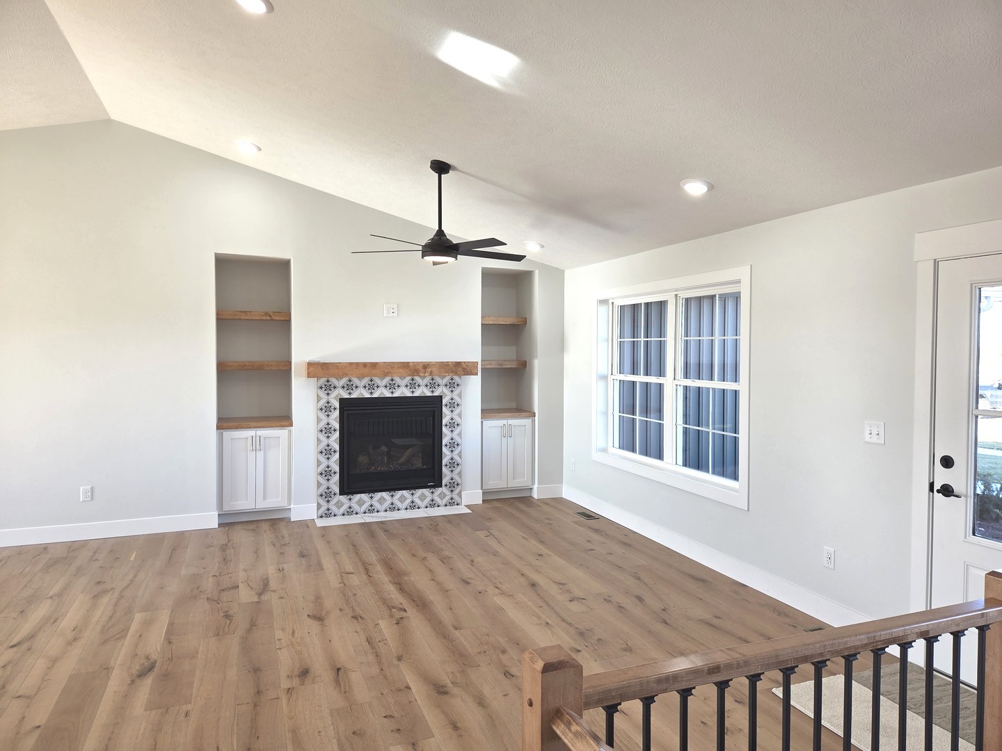 2203 Corrigan Way Normal, IL 61761 - Photo 11 of 51 a view of an empty room with a window and fireplace