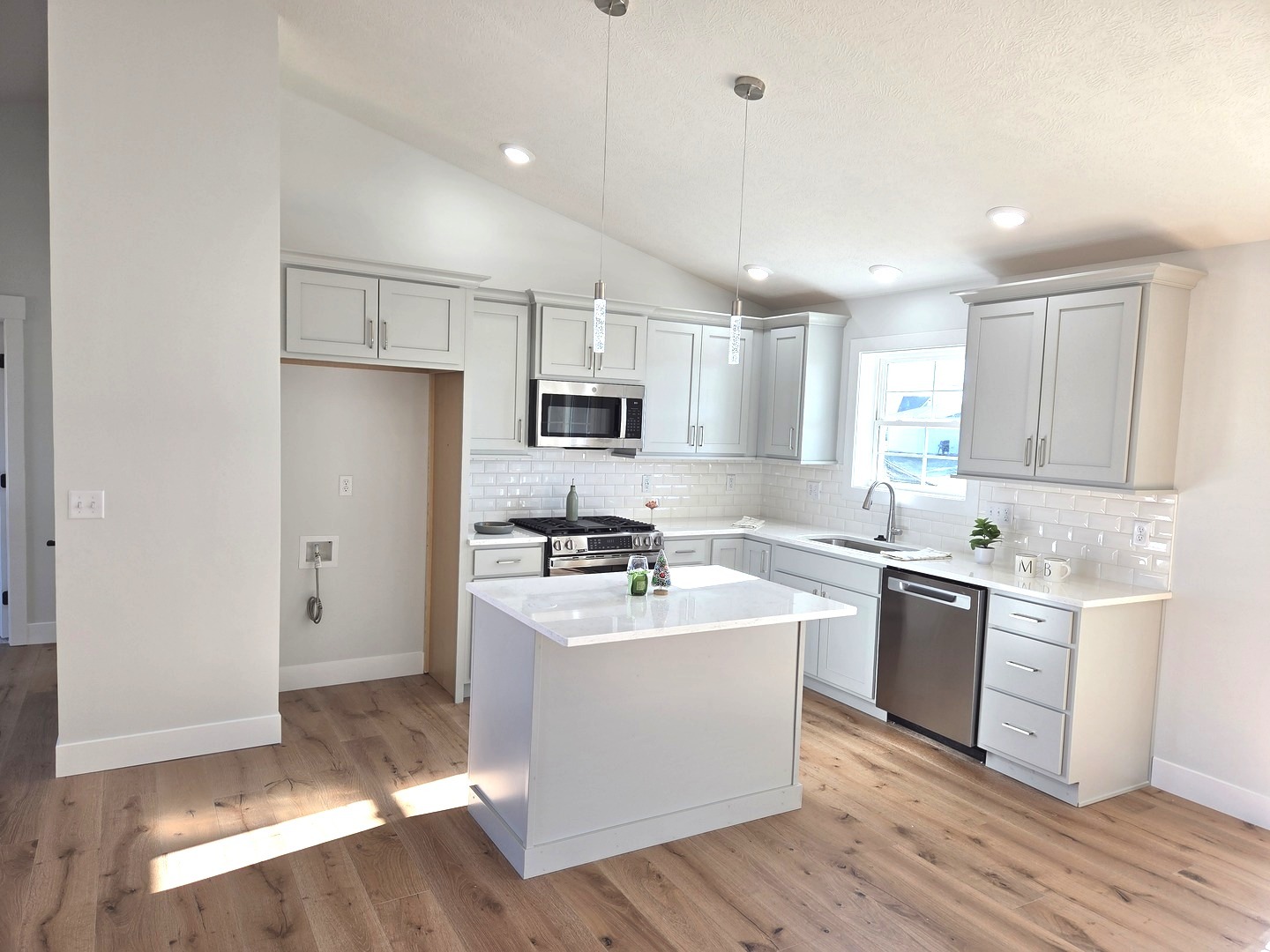 2203 Corrigan Way Normal, IL 61761 - Photo 4 of 51 a kitchen with stainless steel appliances granite countertop a sink stove refrigerator and white cabinets with wooden floor