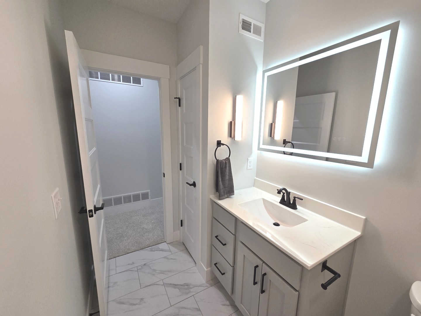 2203 Corrigan Way Normal, IL 61761 - Photo 43 of 51 a bathroom with a sink a mirror and a shower