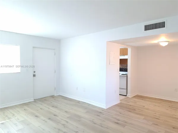 a kitchen with a refrigerator sink and stove