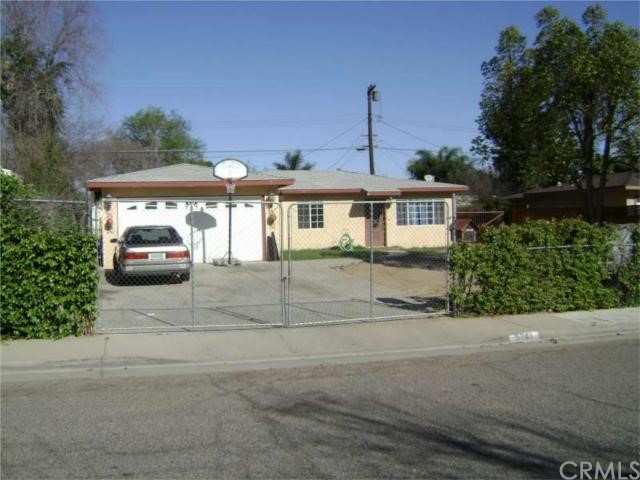 5741 Norman Way Riverside, CA 92504 - Photo 1 of 1 a front view of a house with a garden