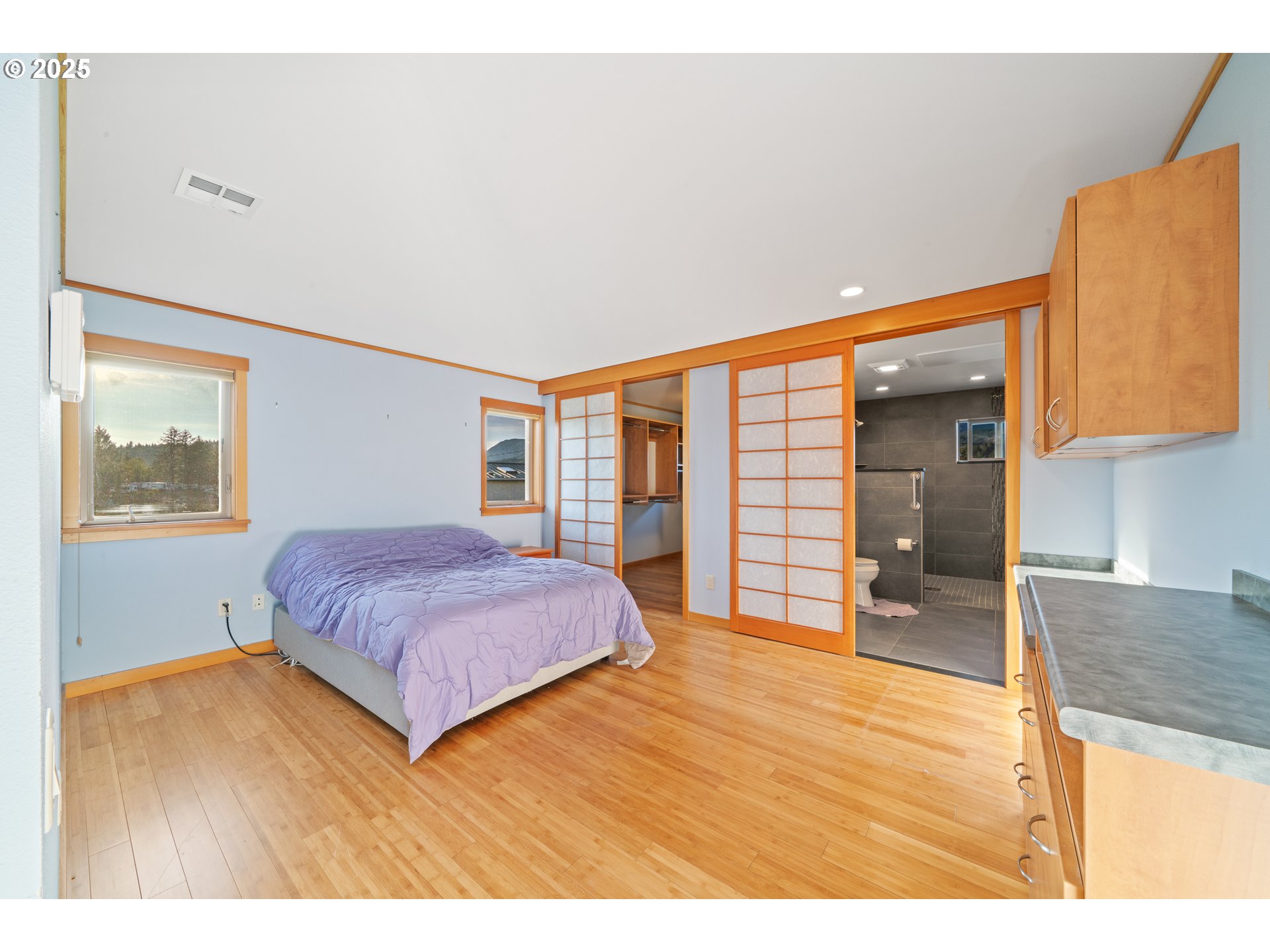 15515 Liars Lair Nehalem, OR 97131 - Photo 16 of 46 a bedroom with a bed and a large window