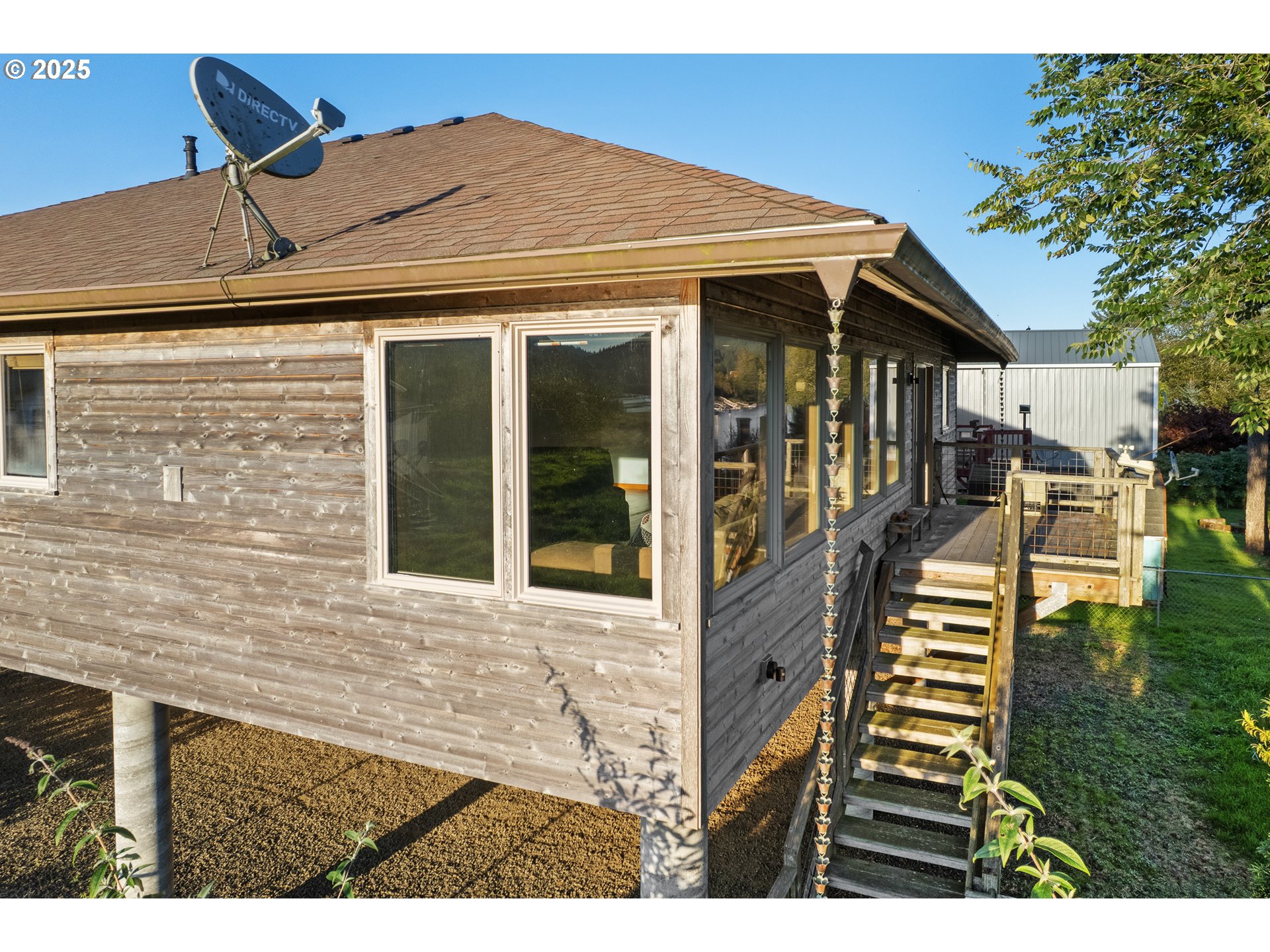 15515 Liars Lair Nehalem, OR 97131 - Photo 38 of 46 a front view of a house with a yard
