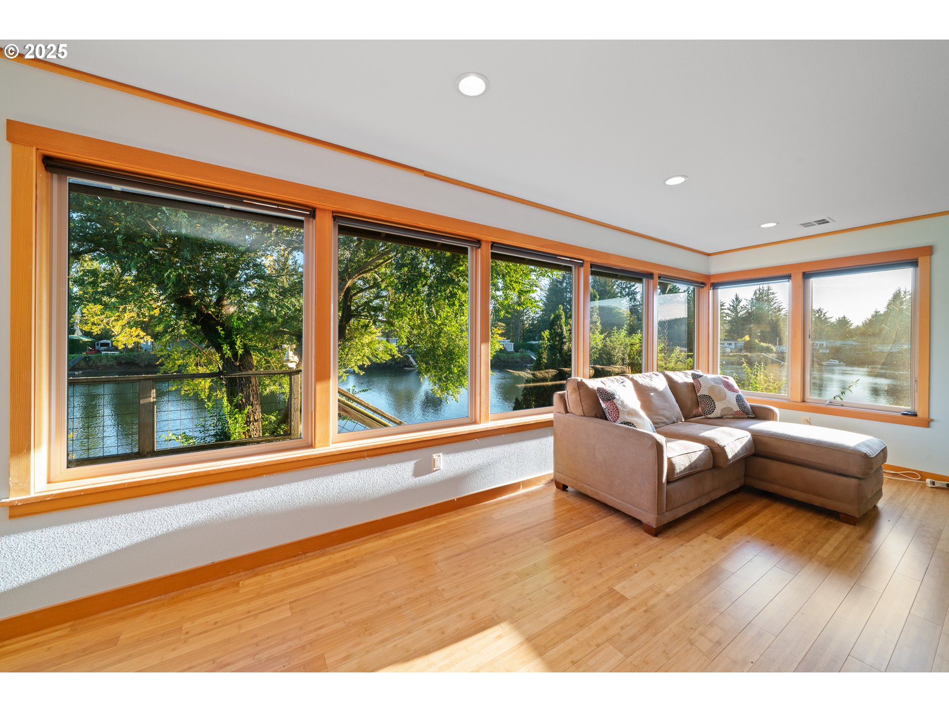 15515 Liars Lair Nehalem, OR 97131 - Photo 8 of 46 a living room with couch and large windows