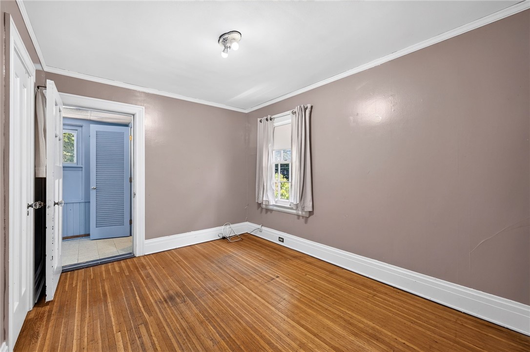 138 Dorchester Road Rochester, NY 14610 - Photo 31 of 41 Bedroom #3 has a clothes closet, hard wood flooring, center lighting & access to a Flex space & closet!