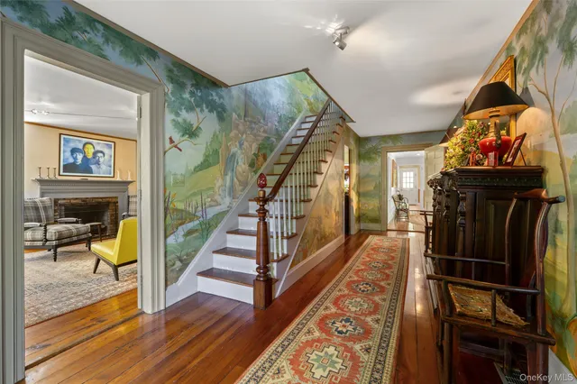a view of an entryway with wooden floor