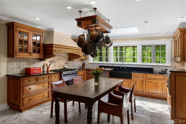 a kitchen with a table chairs and microwave