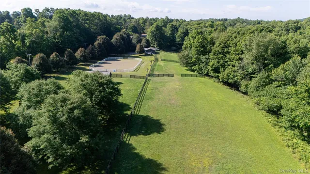 a view of a swimming pool and a yard