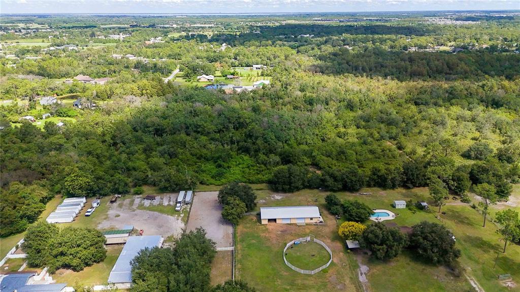 0 Edsel Avenue St. Cloud, FL 34772 - Photo 31 of 38 an aerial view of a house with a yard and lake view