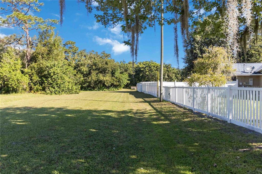 0 Edsel Avenue St. Cloud, FL 34772 - Photo 10 of 38 a view of yard with tree and wooden fence