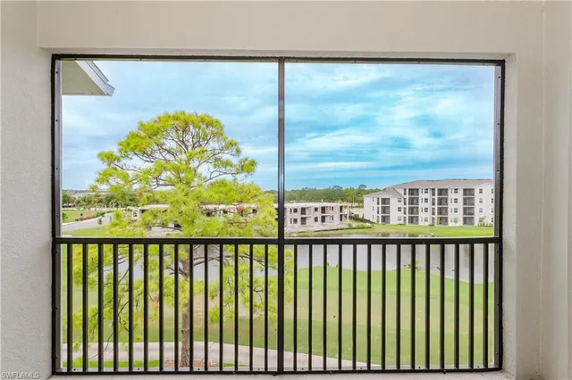 a view of city and mountain from a balcony