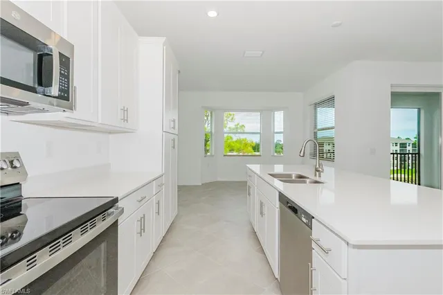 a kitchen with counter top space and stainless steel appliances