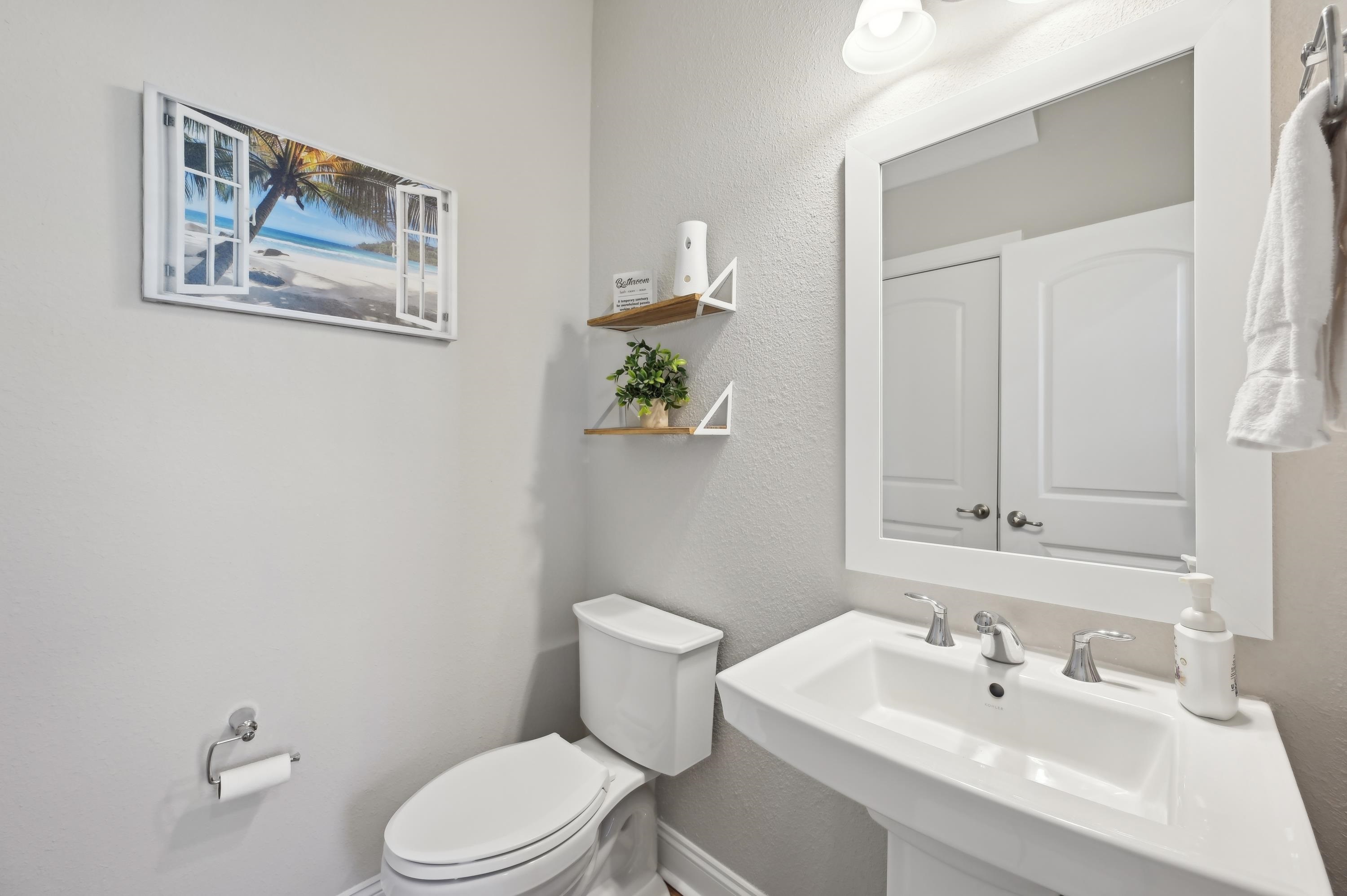 57 Sunset Ridge Court St. Johns, FL 32259 - Photo 22 of 79 a bathroom with a toilet a sink and mirror