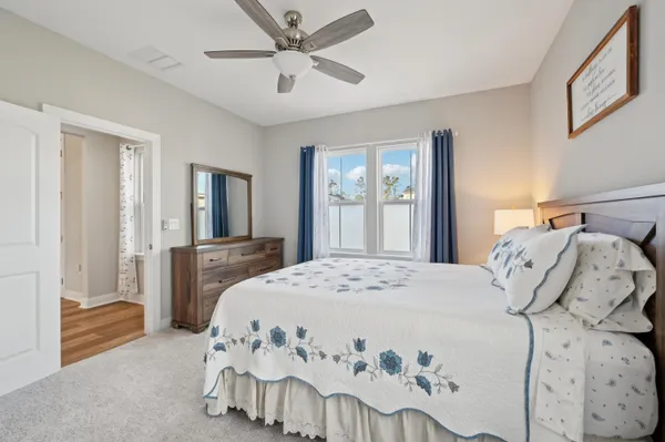 a room with a bed table and a window