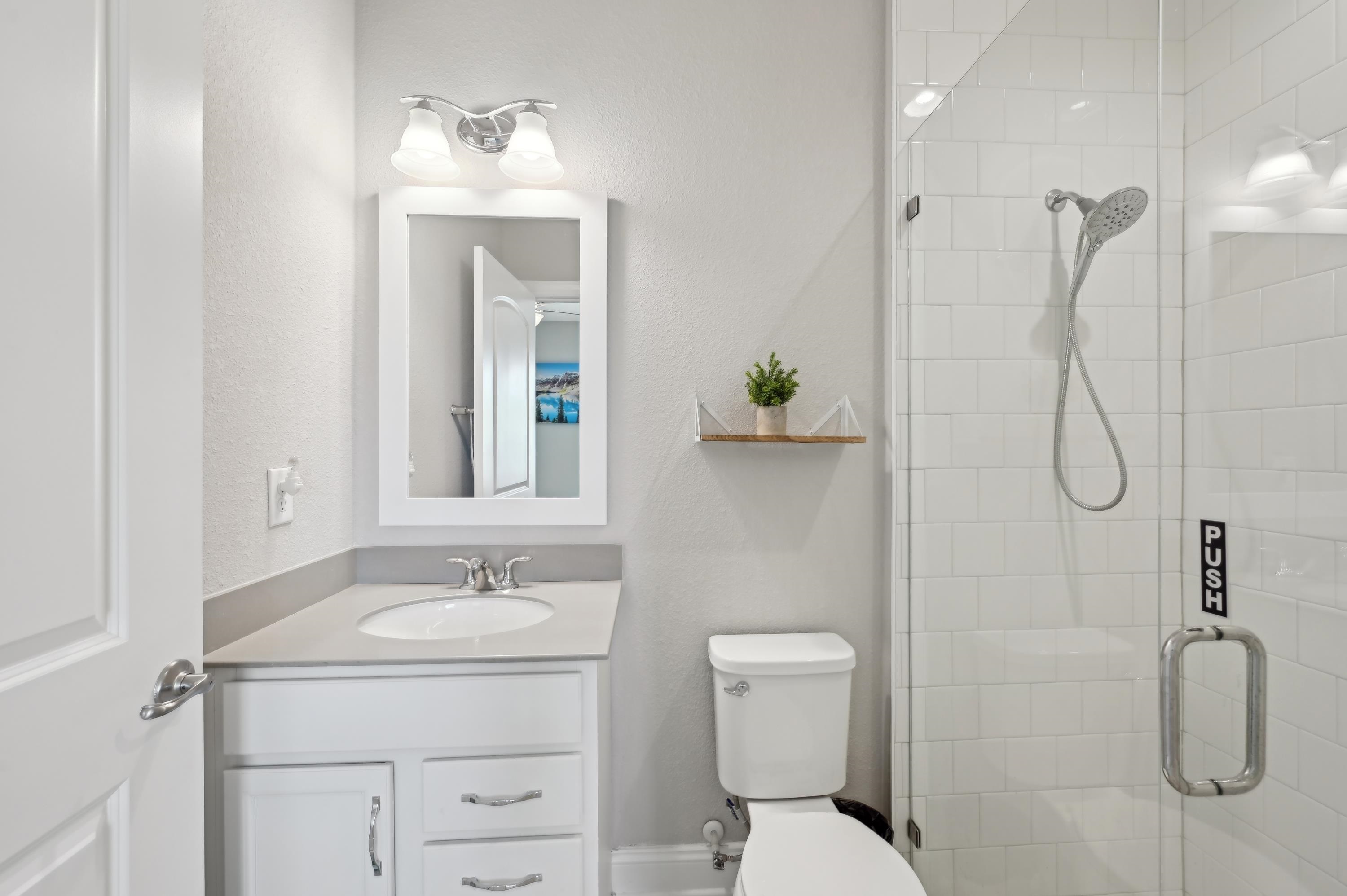 57 Sunset Ridge Court St. Johns, FL 32259 - Photo 30 of 79 a bathroom with a sink vanity mirror and toilet