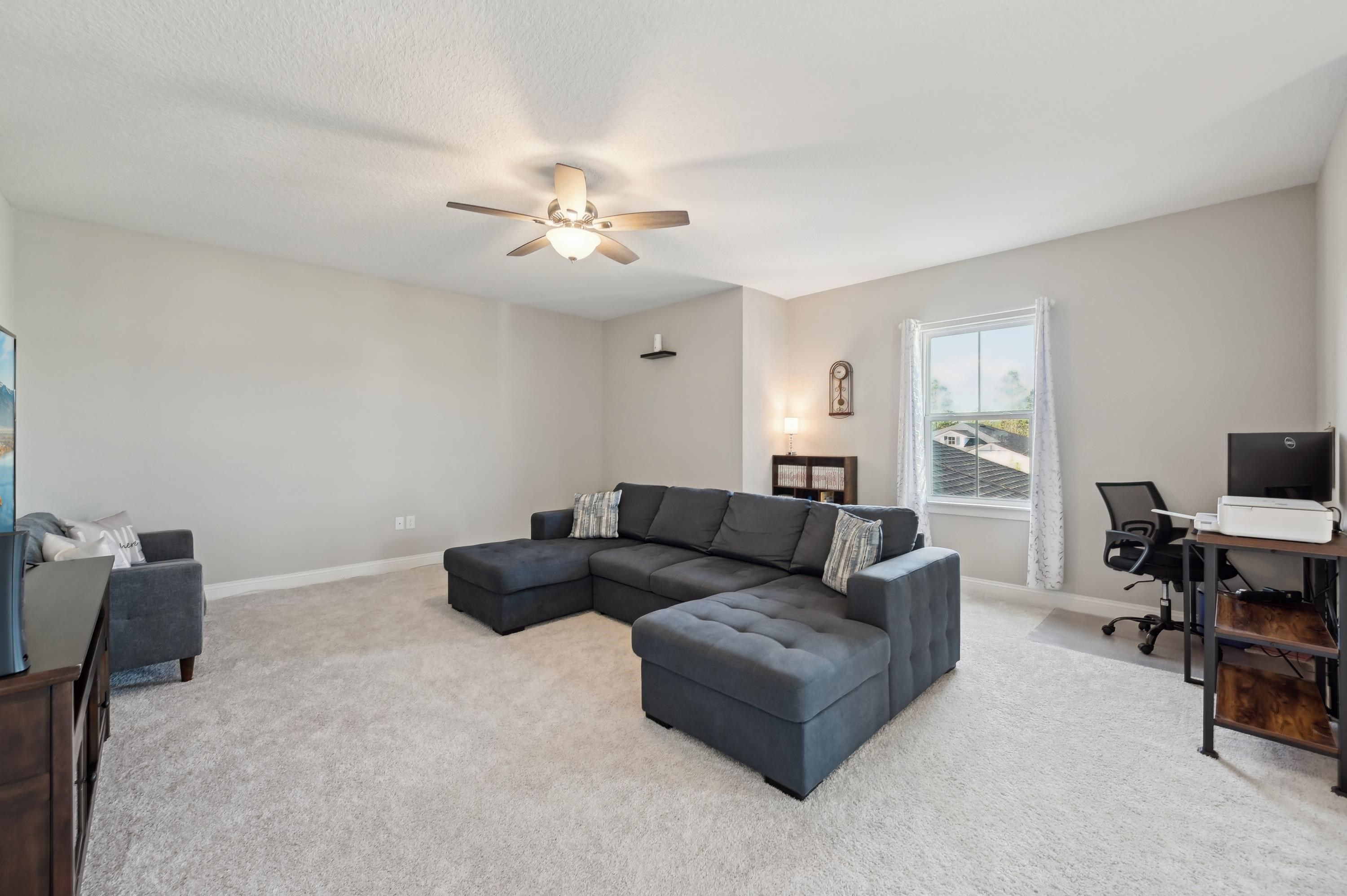 57 Sunset Ridge Court St. Johns, FL 32259 - Photo 31 of 79 a living room with furniture and a flat screen tv