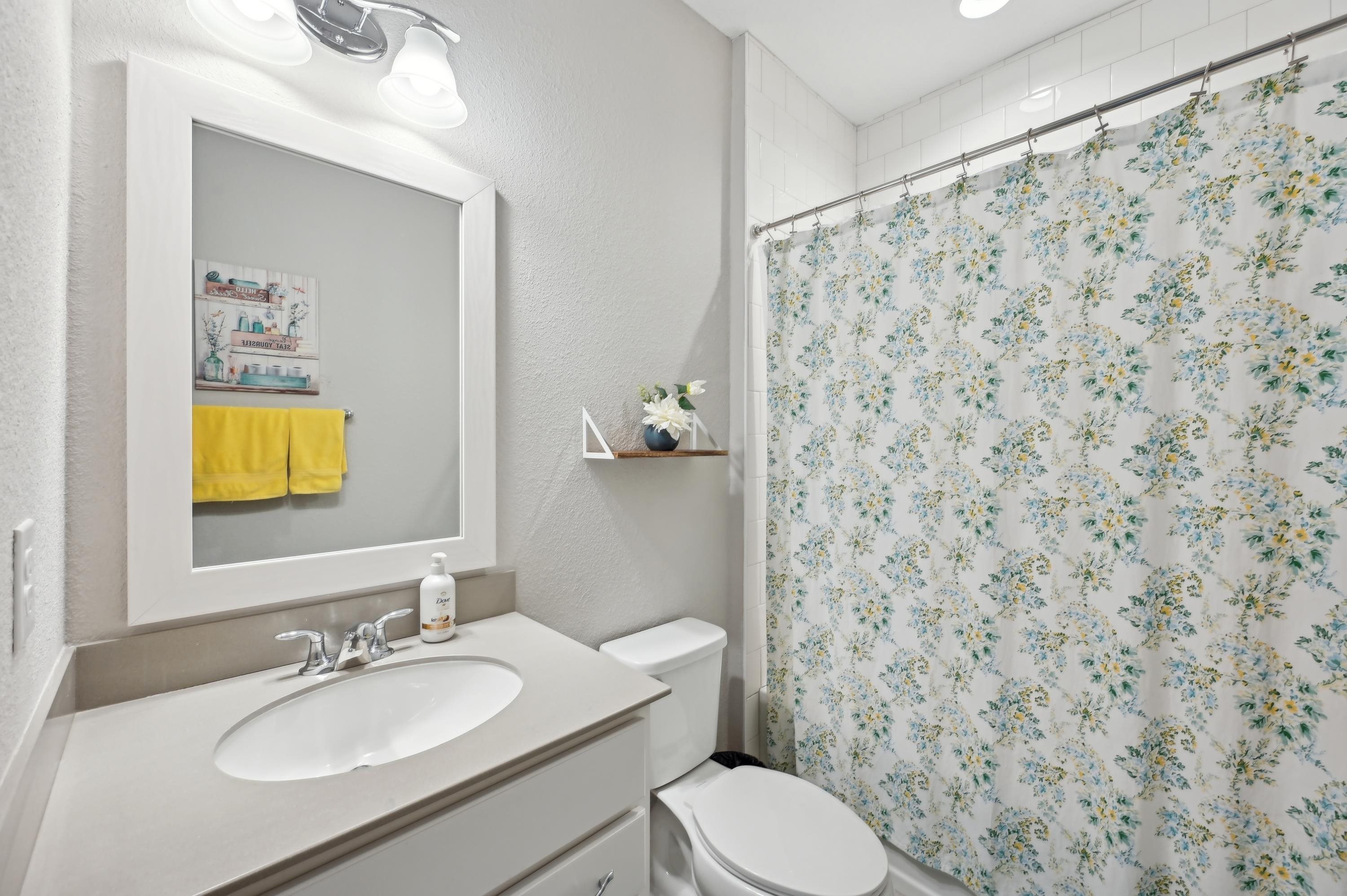 57 Sunset Ridge Court St. Johns, FL 32259 - Photo 40 of 79 a bathroom with a granite countertop sink a mirror and a toilet