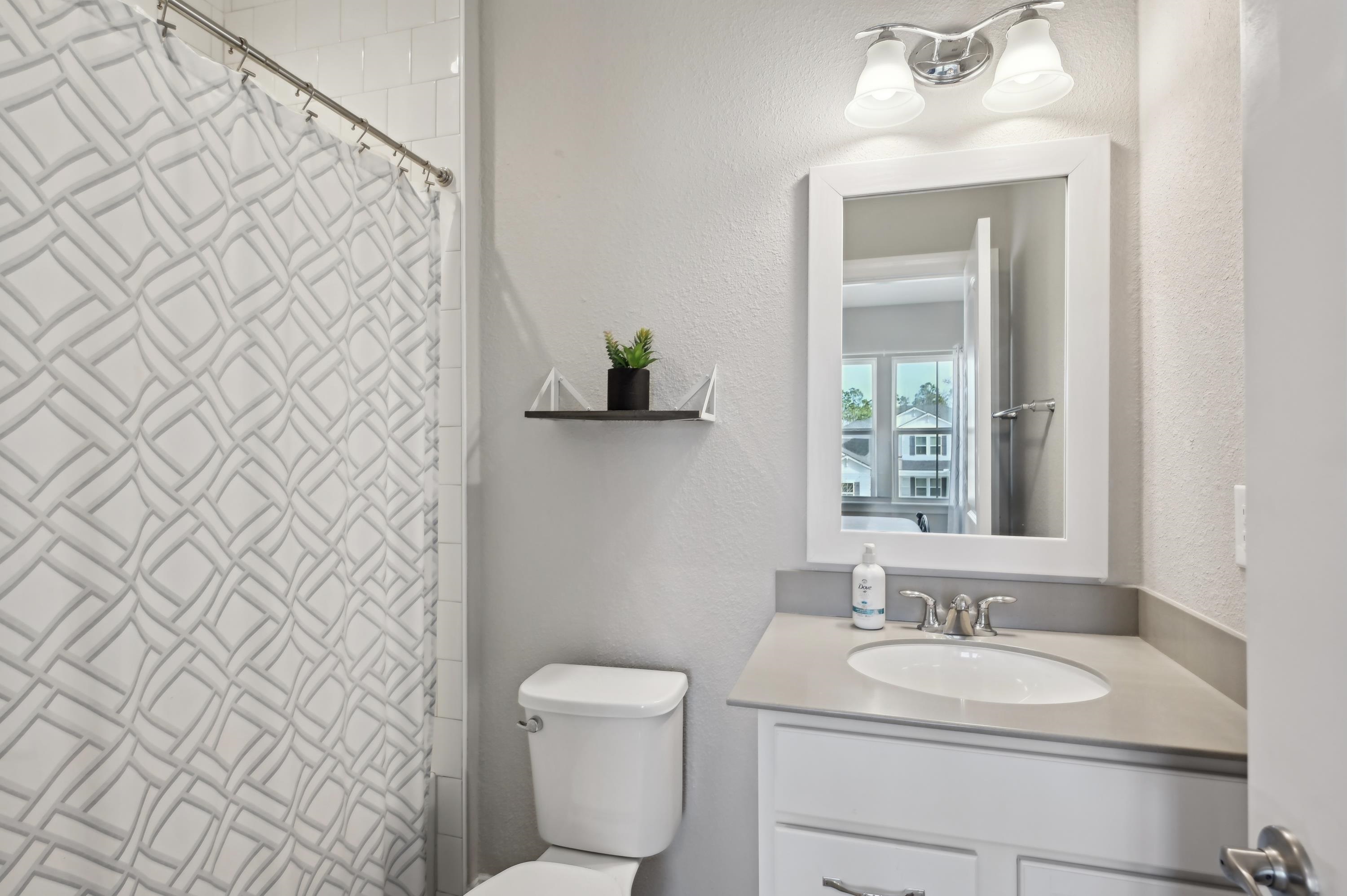 57 Sunset Ridge Court St. Johns, FL 32259 - Photo 44 of 79 a bathroom with a granite countertop sink and a toilet