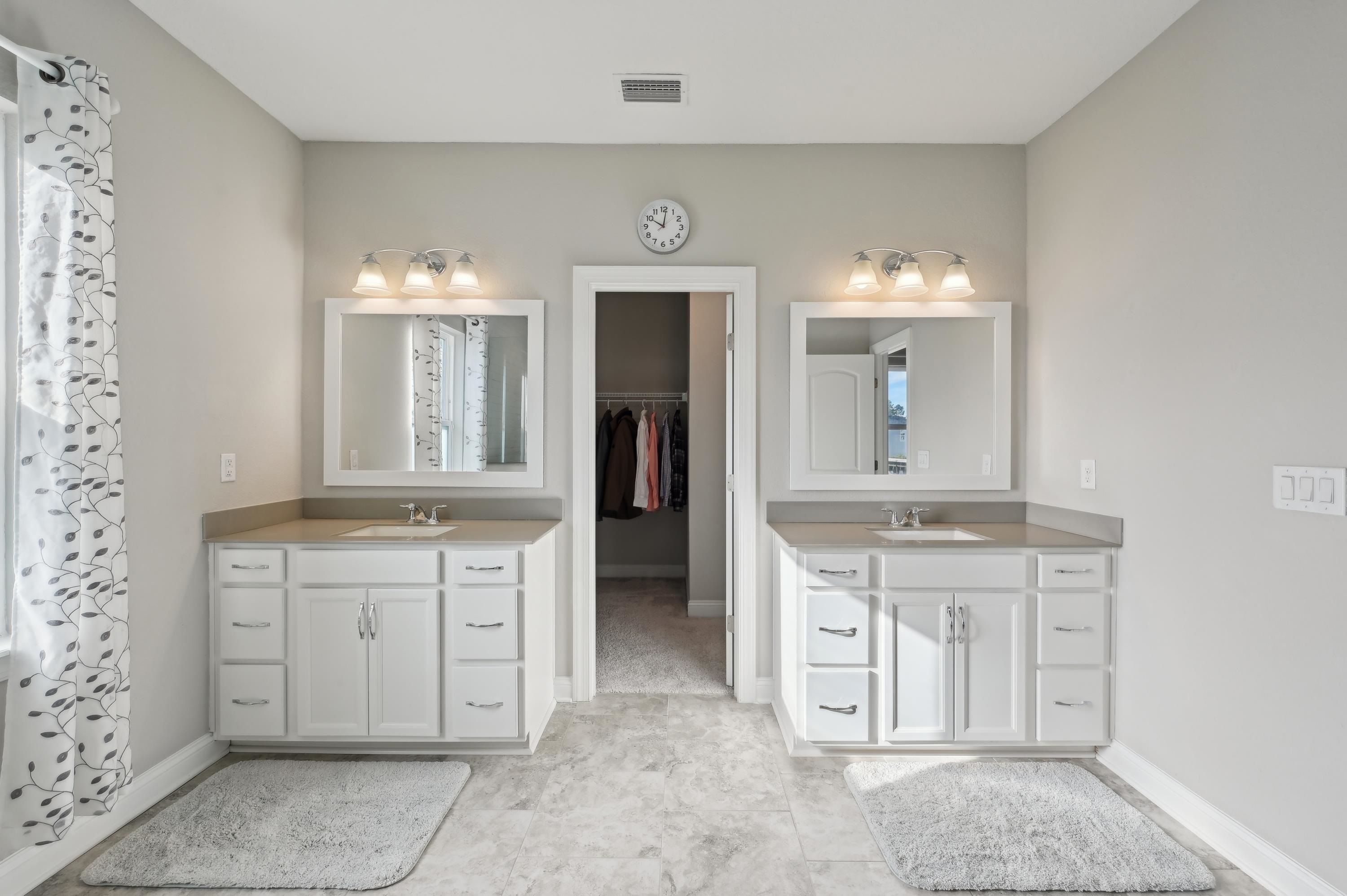 57 Sunset Ridge Court St. Johns, FL 32259 - Photo 50 of 79 a spacious bathroom with a granite countertop sink a mirror and a