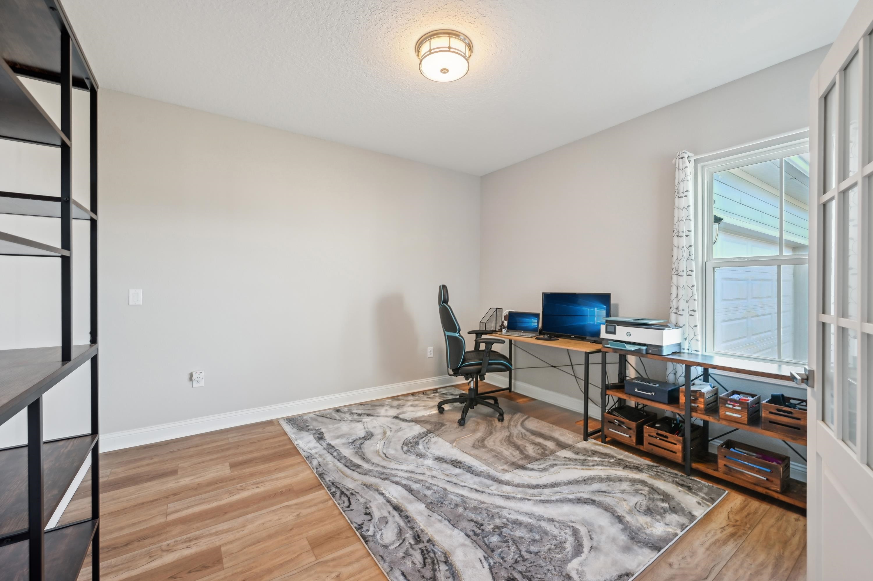 57 Sunset Ridge Court St. Johns, FL 32259 - Photo 55 of 79 a view of a workspace with furniture and a window