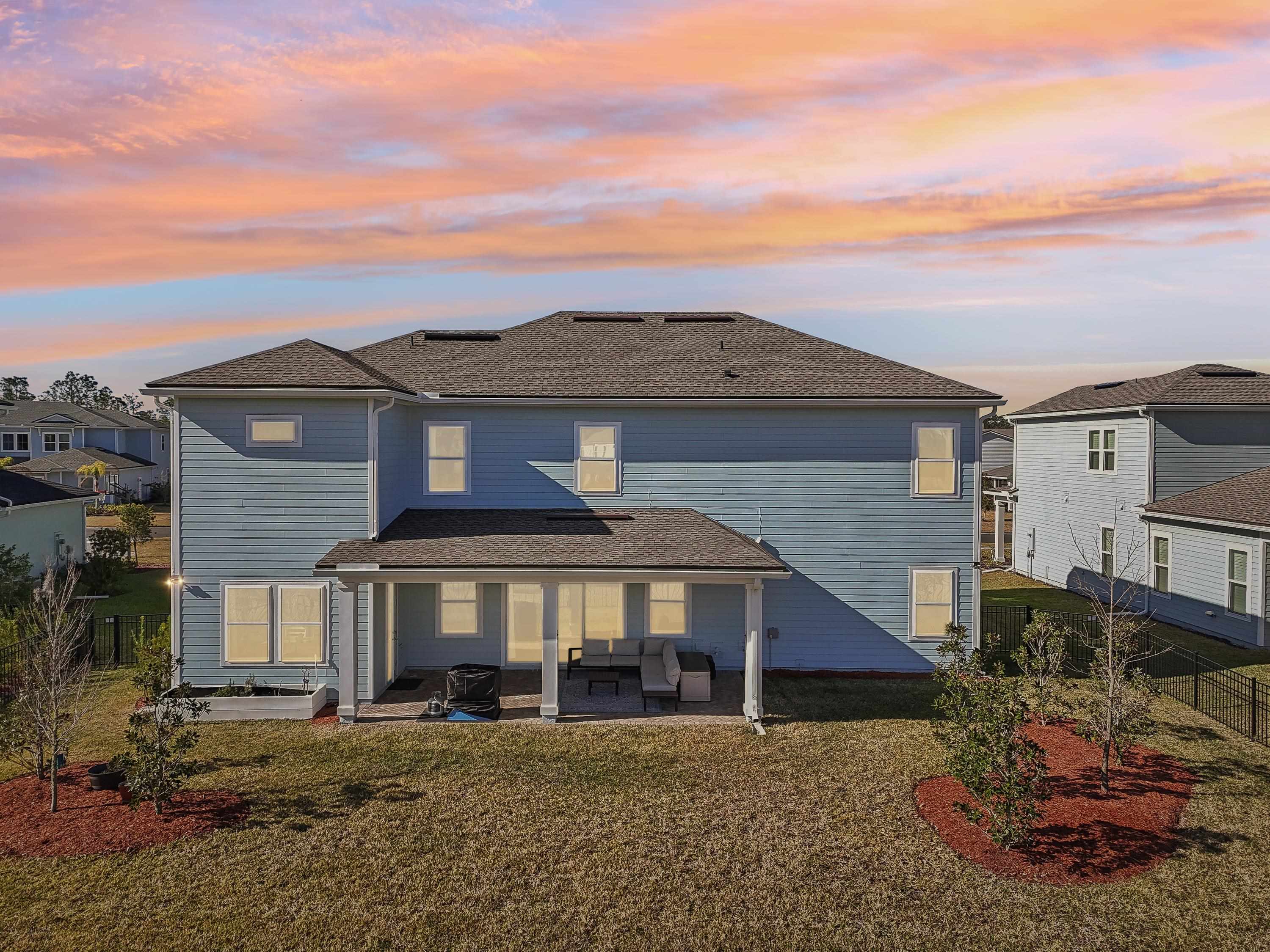 57 Sunset Ridge Court St. Johns, FL 32259 - Photo 78 of 79 a view of a big house with a big yard and large tree
