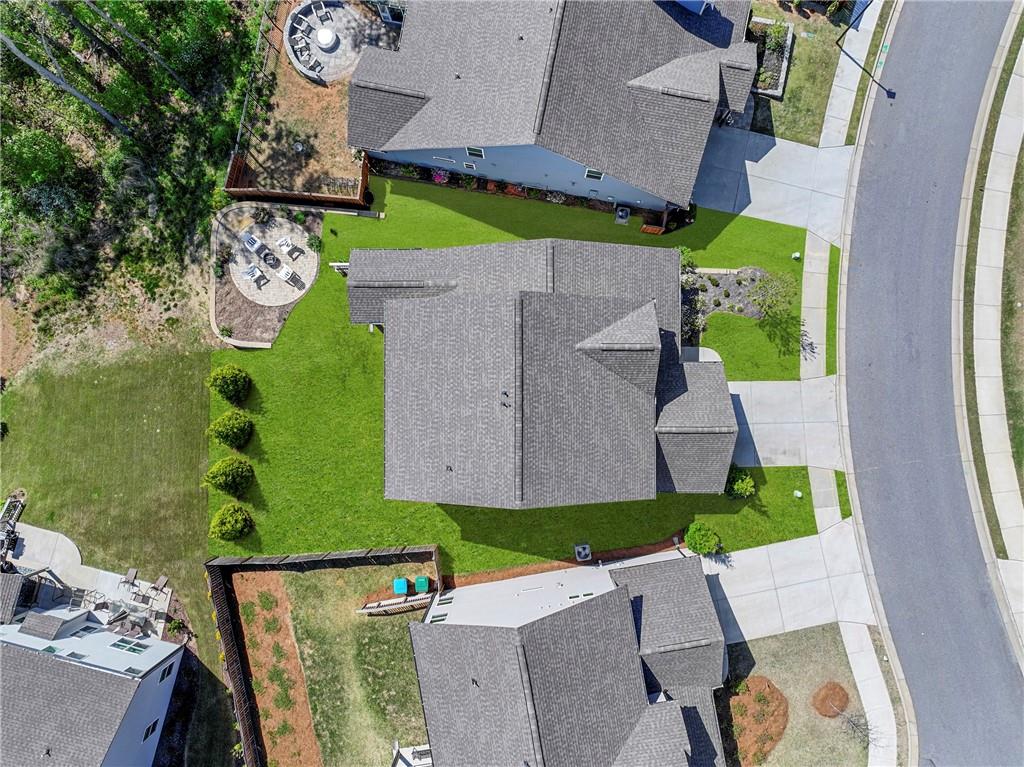 203 Sunshower Ridge Canton, GA 30114 - Photo 41 of 58 an aerial view of a house with garden space pool seating area and car parked