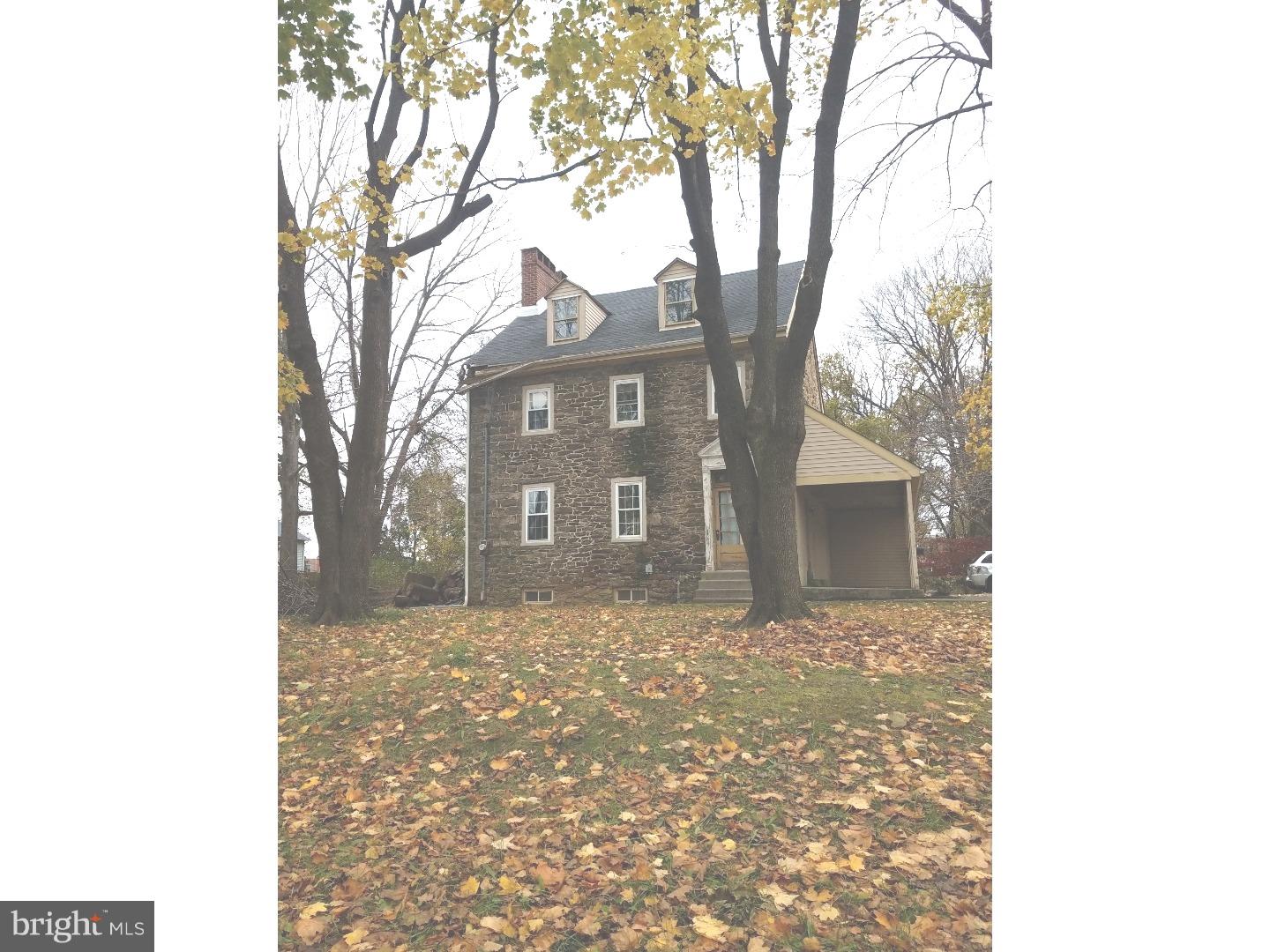 12965 Townsend Road Philadelphia, PA 19154 - Photo 5 of 10 a brick building with a tree