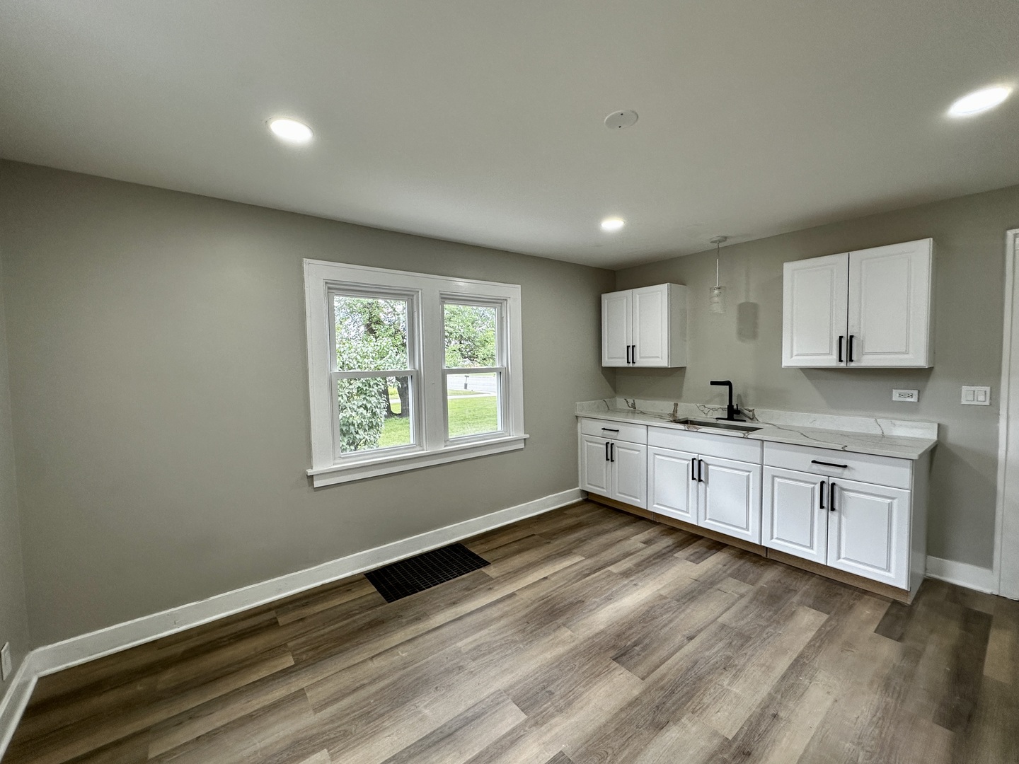 15955 State Street South Holland, IL 60473 - Photo 6 of 9 a large kitchen with stainless steel appliances granite countertop a stove a sink white cabinets and a wooden floor