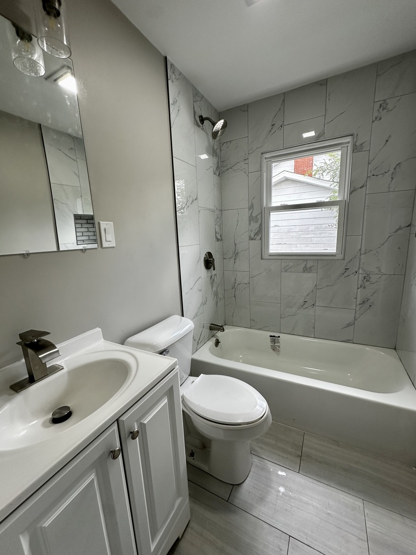 15955 State Street South Holland, IL 60473 - Photo 7 of 9 a bathroom with a sink toilet and shower