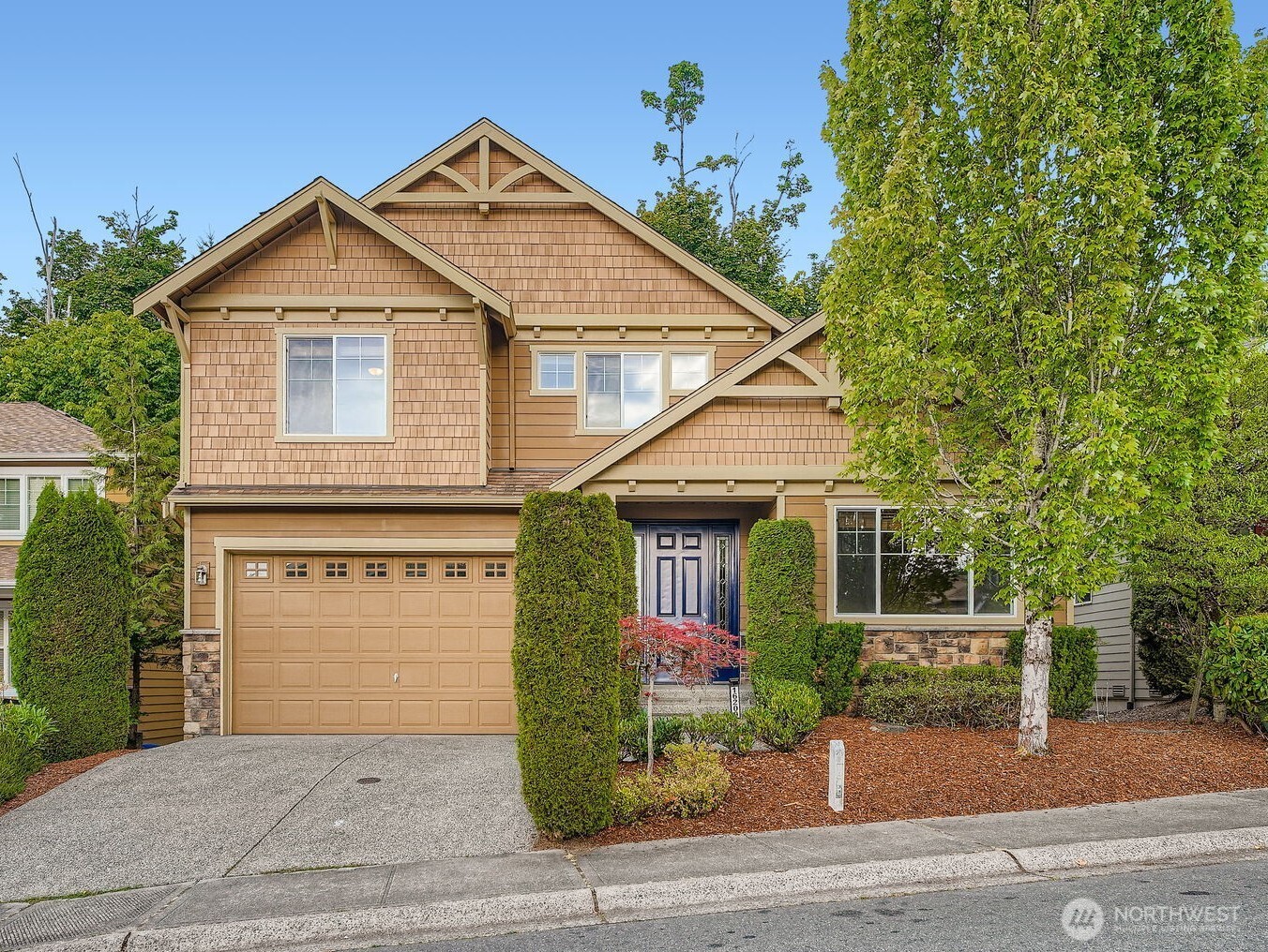 16200 Parkside Way Southeast Renton, WA 98058 - Photo 1 of 40 a front view of a house with a yard and garage