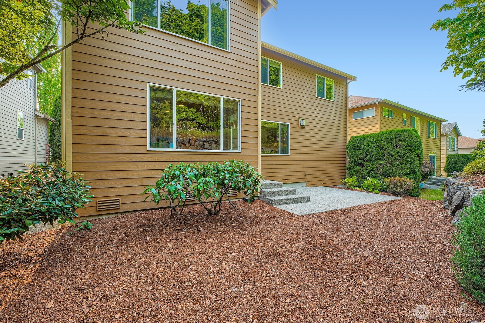 16200 Parkside Way Southeast Renton, WA 98058 - Photo 24 of 40 a front view of a house with a yard and potted plants