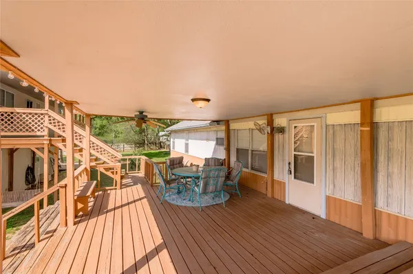 a view of a house with a patio and wooden floor