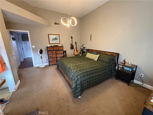 a kitchen with stainless steel appliances a white stove top oven sink and cabinets
