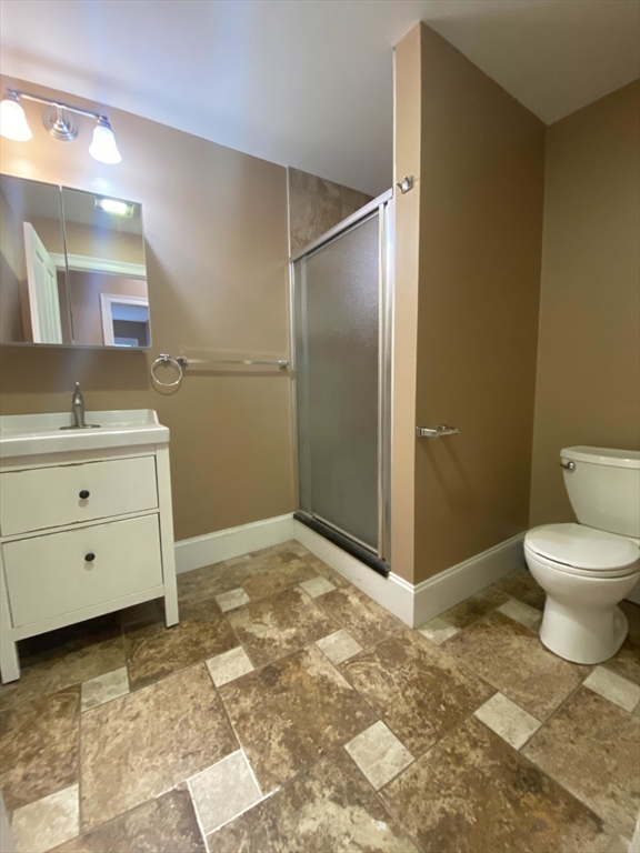 1592 Beacon Street, Unit 2 Brookline, MA 02446 - Photo 10 of 10 a bathroom with a sink toilet and shower