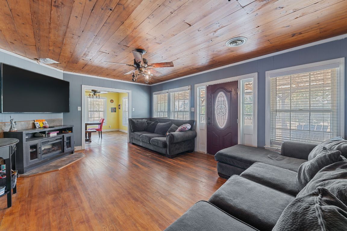 274 Old Potato Road Paige, TX 78659 - Photo 13 of 40 a living room with furniture and a flat screen tv