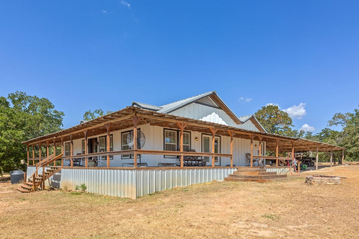 274 Old Potato Road Paige, TX 78659 - Photo 2 of 40 a front view of a house with a porch