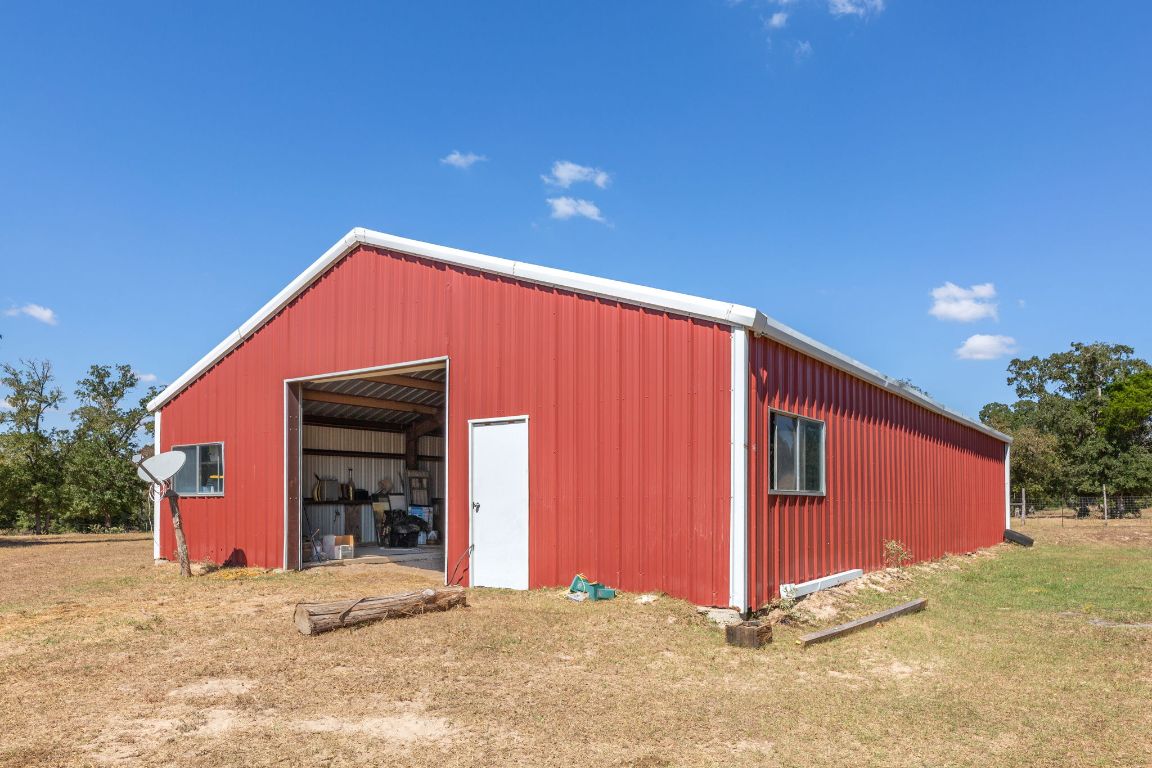 274 Old Potato Road Paige, TX 78659 - Photo 22 of 40 a view of a house with a yard