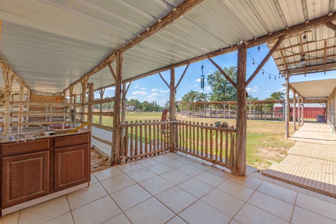 274 Old Potato Road Paige, TX 78659 - Photo 28 of 40 a view of a porch with wooden floor and outdoor space