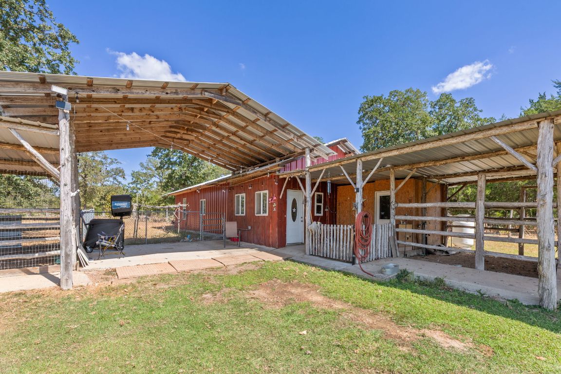 274 Old Potato Road Paige, TX 78659 - Photo 29 of 40 front view of a house with a big yard