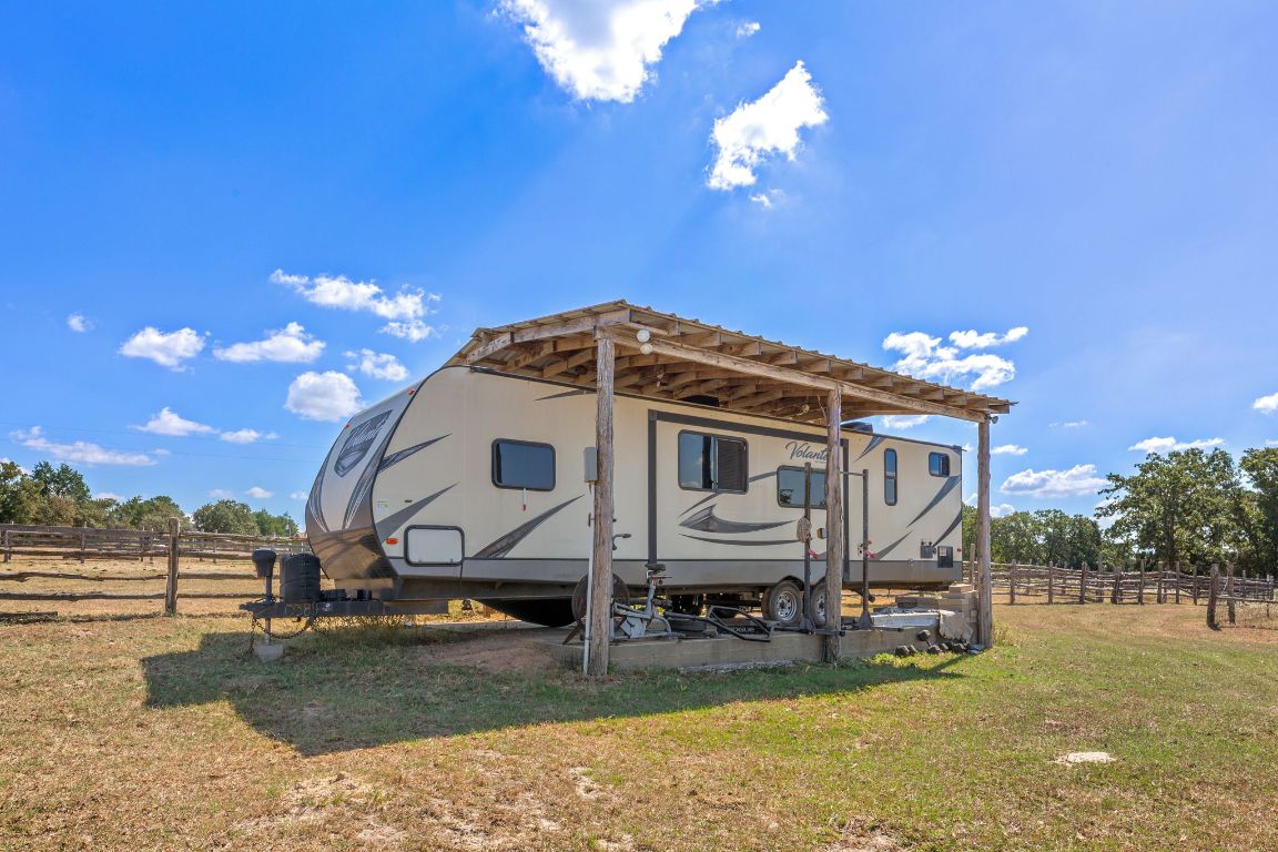 274 Old Potato Road Paige, TX 78659 - Photo 31 of 40 a view of a house with swimming pool and a yard