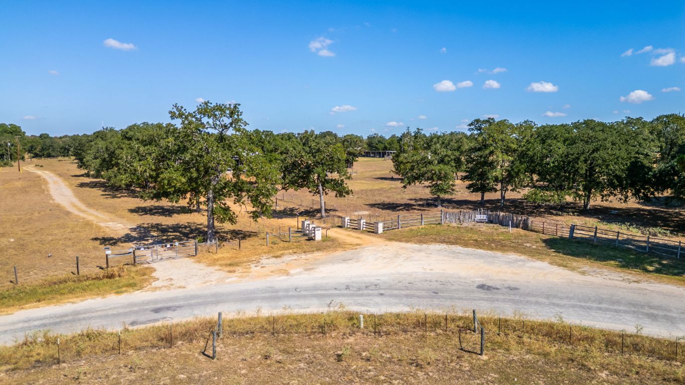 274 Old Potato Road Paige, TX 78659 - Photo 33 of 40 a view of a swimming pool with an outdoor space and seating area