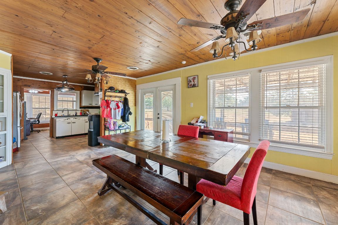 274 Old Potato Road Paige, TX 78659 - Photo 10 of 40 a view of a dining room with furniture window and outside view