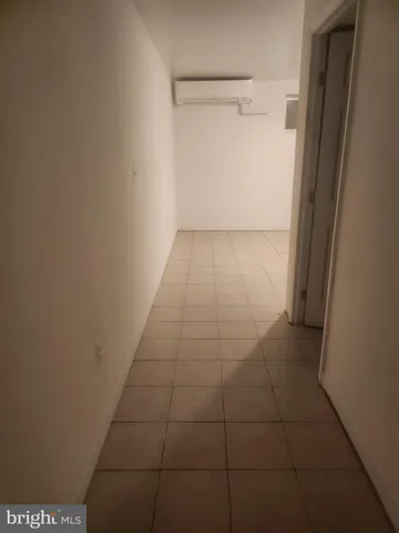 a bathroom with a glass door shower