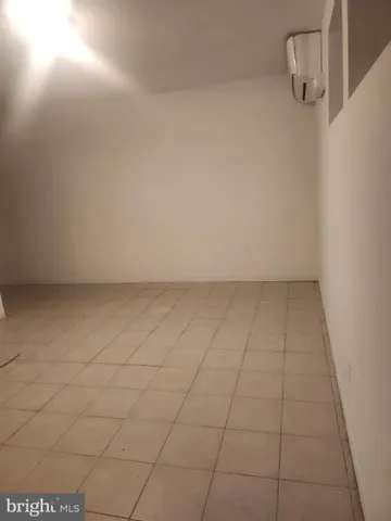 an empty room with a bench