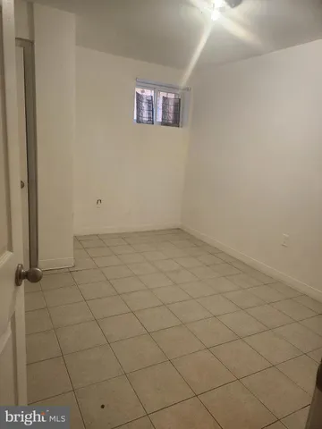 a view of an empty room and a window