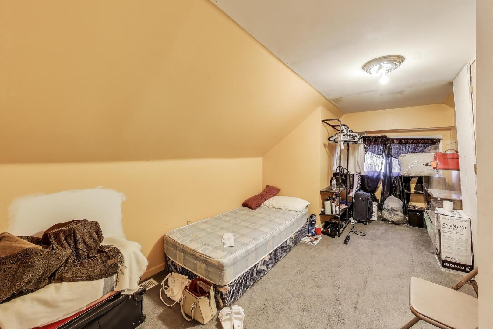 8822 South Ada Street Chicago, IL 60620 - Photo 13 of 25 a view of a room with gym equipment