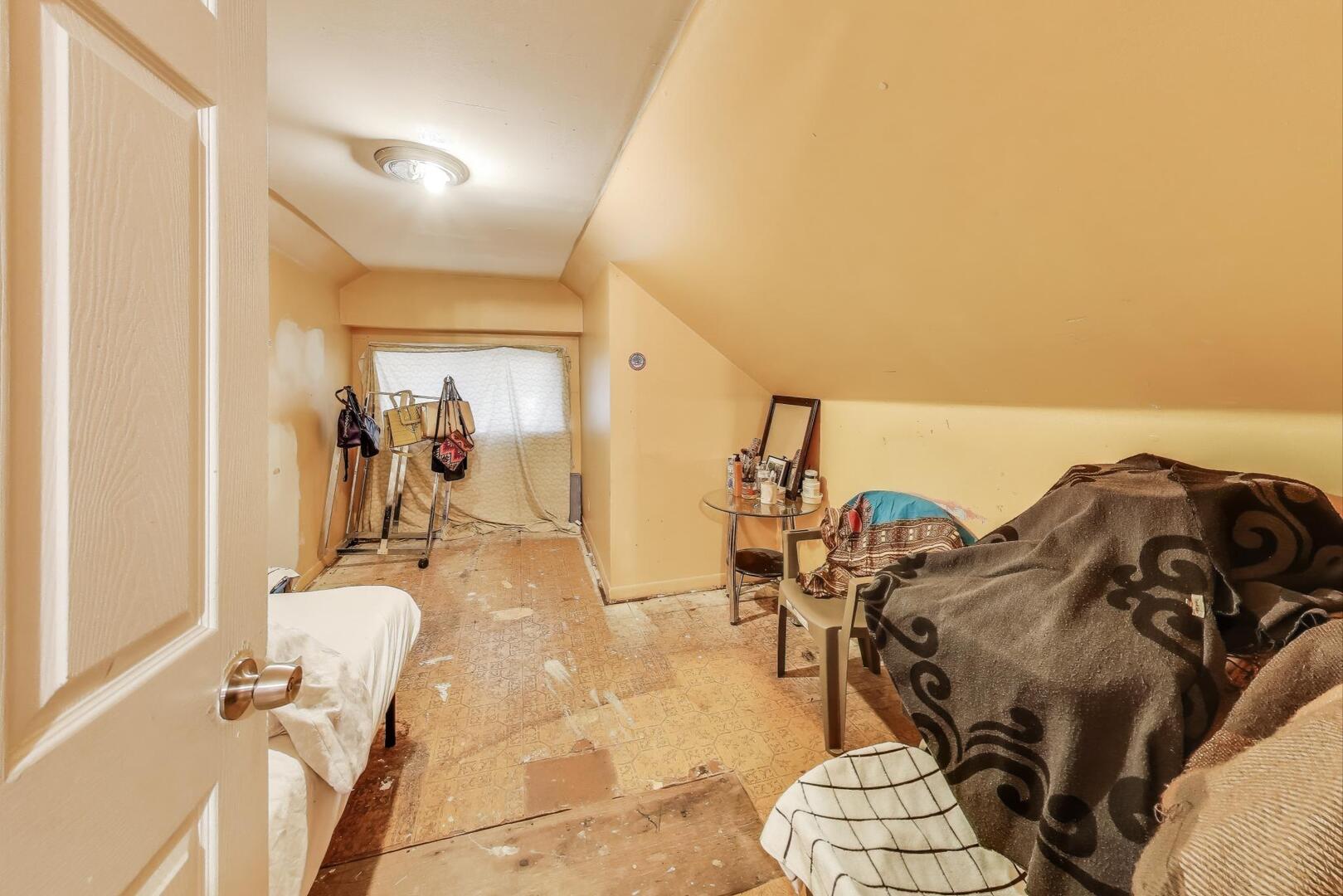 8822 South Ada Street Chicago, IL 60620 - Photo 15 of 25 a view of a living room with furniture and a floor to ceiling window