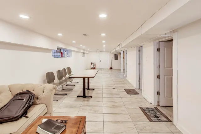 a view of kitchen with furniture and windows