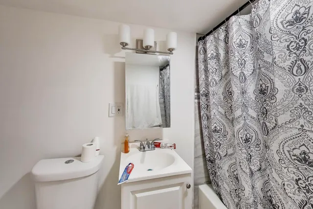 a bathroom with a sink and toilet